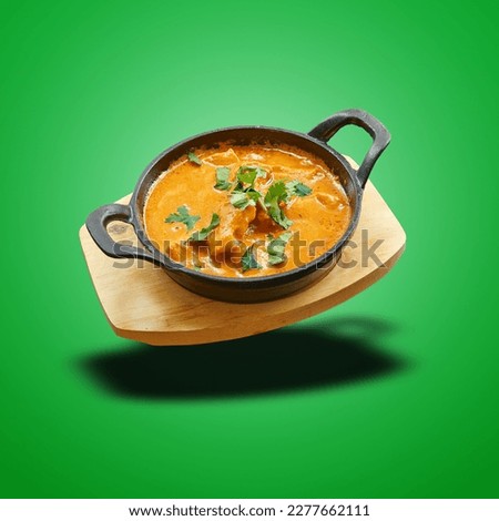 Floating Chicken butter baked in little panon green gradient background Royalty-Free Stock Photo #2277662111