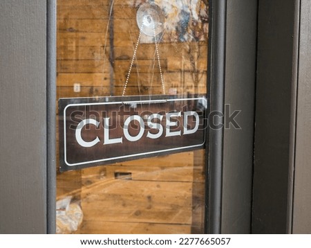 A shop closed sign, concept for business hours, cost of living, signage and economy. Copy space.

