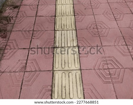 tactile paving for blind handicap on tiles pathway, walkway for blindness people