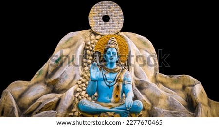 beautiful lord shiva sits on mountains statue on black background Royalty-Free Stock Photo #2277670465