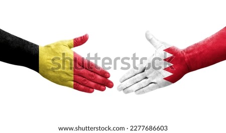Handshake between Bahrain and Belgium flags painted on hands, isolated transparent image.