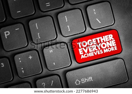 Together Everyone Achieves More text button on keyboard, concept background