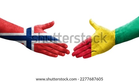 Handshake between Guinea and Norway flags painted on hands, isolated transparent image.