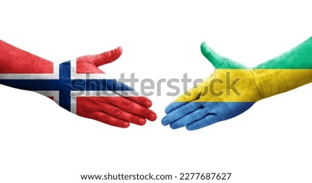 Handshake between Gabon and Norway flags painted on hands, isolated transparent image.