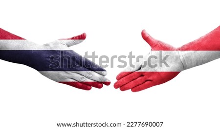 Handshake between Austria and Thailand flags painted on hands, isolated transparent image.