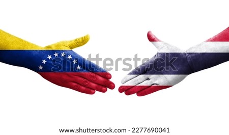 Handshake between Thailand and Venezuela flags painted on hands, isolated transparent image.