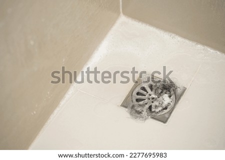 Waste hair fragments cause Clogged pipe in the bathroom Royalty-Free Stock Photo #2277695983