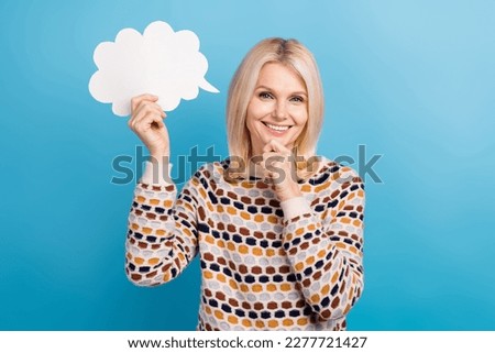 Photo of pretty clever person arm touch chin hold empty space cloud dialogue card isolated on blue color background