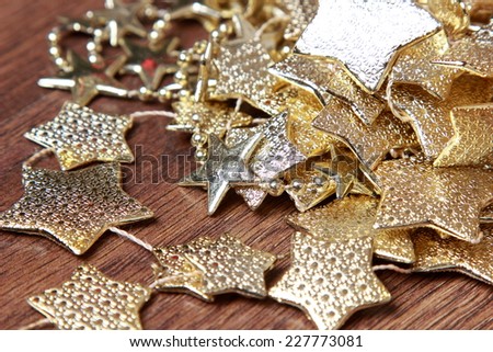golden stars decoration over dark brown wooden background