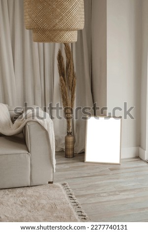 Empty white rectangle frame lifestyle mockup in neutral scandinavian interior for presentation own digital arts, paintings and photos for sell it