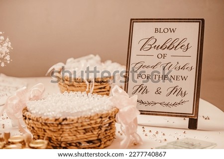 Blow bubbles sign at a wedding