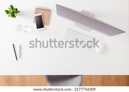 Office desktop with computer and accessories. Top view