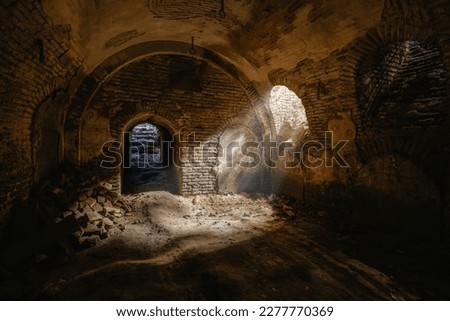 Dark underground cellar under old castle. Royalty-Free Stock Photo #2277770369