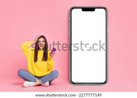 Full length photo of young excited girl omg wow hand touch head use mobile app button isolated over pink color background