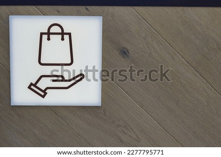 White plastic locker sign wooden wall background.
