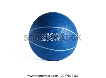 A blue medicine ball 2 kg for fitness and rehabilitation isolated on a white background.