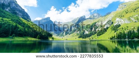 

Lake in the Swiss Alps. Panoramic view of the nature and mountains of Switzerland. Royalty-Free Stock Photo #2277835553