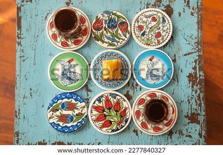 Photograph of Turkish Baklava in Ottoman Tile Turkish Coffee Cup and Turkish Tea Concept, Uskudar Istanbul, Turkey Royalty-Free Stock Photo #2277840327