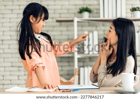 Portrait of enjoy happy love asian family mature mother and girl daughter smiling play laughing and having fun together.happy family in moments good time at home