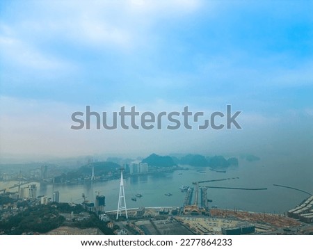 Panorama of Ha Long City, Vietnam, with Sun World Halong park and Bai Chay bridge. Near Halong Bay, UNESCO World Heritage Site. View from Cua Luc bay to Ha Long bay