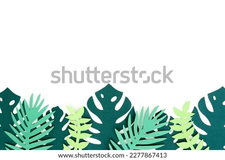 A studio photo of a paper leaf cutout