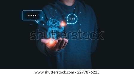 A person stretches out his hand with a model of a robot on his palm. Demonstrates the use of ai and chat GPT systems to research and work. Royalty-Free Stock Photo #2277876225