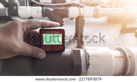 The Plumber Intalling Pipe Leveling used Digital Magnetic Level Protractor Angle.