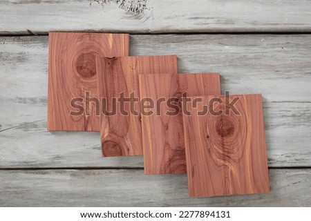 Aromatic cedar blocks set  on white wood background. Royalty-Free Stock Photo #2277894131