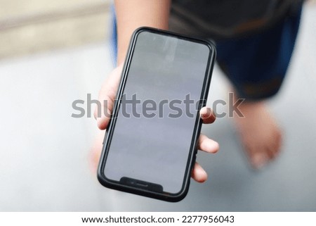 Photo of an empty cell phone held in hand
