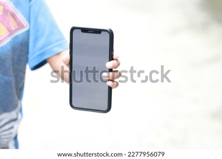 Photo of an empty cell phone held in hand