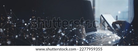 Digital technology, internet network connection, big data, digital marketing IOT internet of things. Man using mobile phone and laptop computer surfing internet, innovative technology background