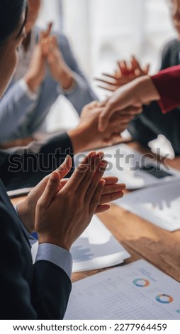 Shaking hands, Team of lawyers and tax auditors brainstorming together and calculating the balance sheet and historical financial accounts of the company and shareholders. Royalty-Free Stock Photo #2277964459