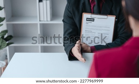 Close up view of job interview with applicant with resume paper in office, Recruitment, Job application concept.