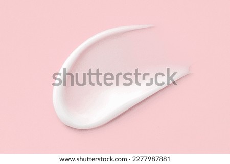 cosmetic smears cream texture on pink background