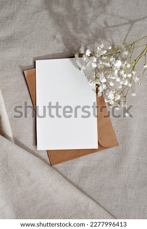 Empty paper card with copy space on a beige background, elegant business, branding template, congratulation letter mockup