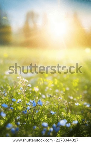 Spring flower nature background. Blue tiny flowers on spring blooming meadow with flying butterflies. Banner of a fresh blooming forget-me-not in the sunshine