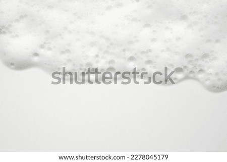 Abstract white soap foam bubbles texture on white background