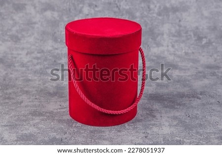 Red gift box on grunge background. Retro style toned picture