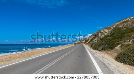 Amiros Beach along the beautiful country road called Epar.Od. Kalavardas-Empona. Located in the northwestern part of the Greek island of Rhodes. Royalty-Free Stock Photo #2278057003