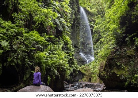 A young woman in Tilos waterfall, La Palma Island, Canary Islands, Spain. Royalty-Free Stock Photo #2278073375