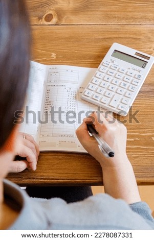Household accounts book and saving money. Calculating personal finance. Royalty-Free Stock Photo #2278087331