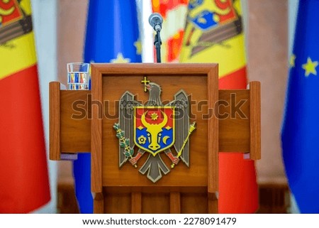 The coats of arms of Republic of Moldova, the official symbol of the state on central tribune in the presidential palace.