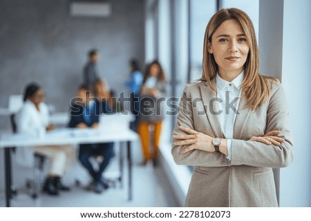Portrait of a businesswoman standing in a a modern office. Portrait of beautyful and confident business woman. I've solidified my name in the business world. Portrait of middle aged businesswoman 