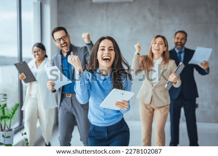 Portrait of overjoyed young diverse employees workers show thumb up recommend good quality company service. Smiling multiethnic colleagues celebrate shared business success or victory in office Royalty-Free Stock Photo #2278102087