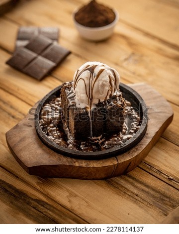 Hot Sizzling Brownie with Vanilla Ice Cream Royalty-Free Stock Photo #2278114137
