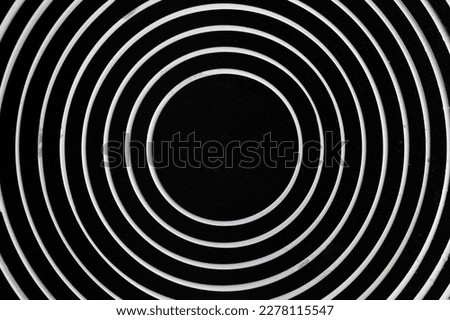 Frying pan background. Bottom side of frying pan. Circular pattern. Optical illusion design. Royalty-Free Stock Photo #2278115547