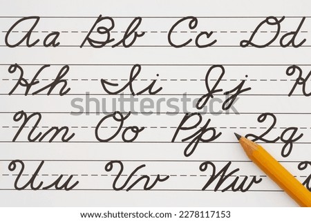 Cursive writing on vintage ruled line notebook paper with a pencil Royalty-Free Stock Photo #2278117153