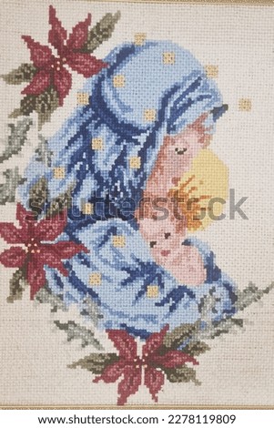 Picture of Our Lady and the baby Jesus embroidered in sheep wool threads in whitewashed stitches