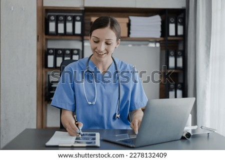 Doctor woman working with laptop and conducts video consultation an online conference, Healthcare technology and medical concept. 