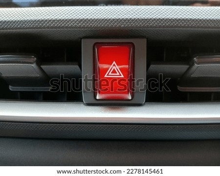 emergency stop button between the air conditioner grilles